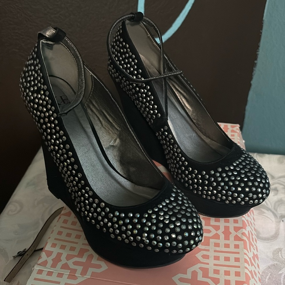 Bke sole black suede rhinestone shoes.